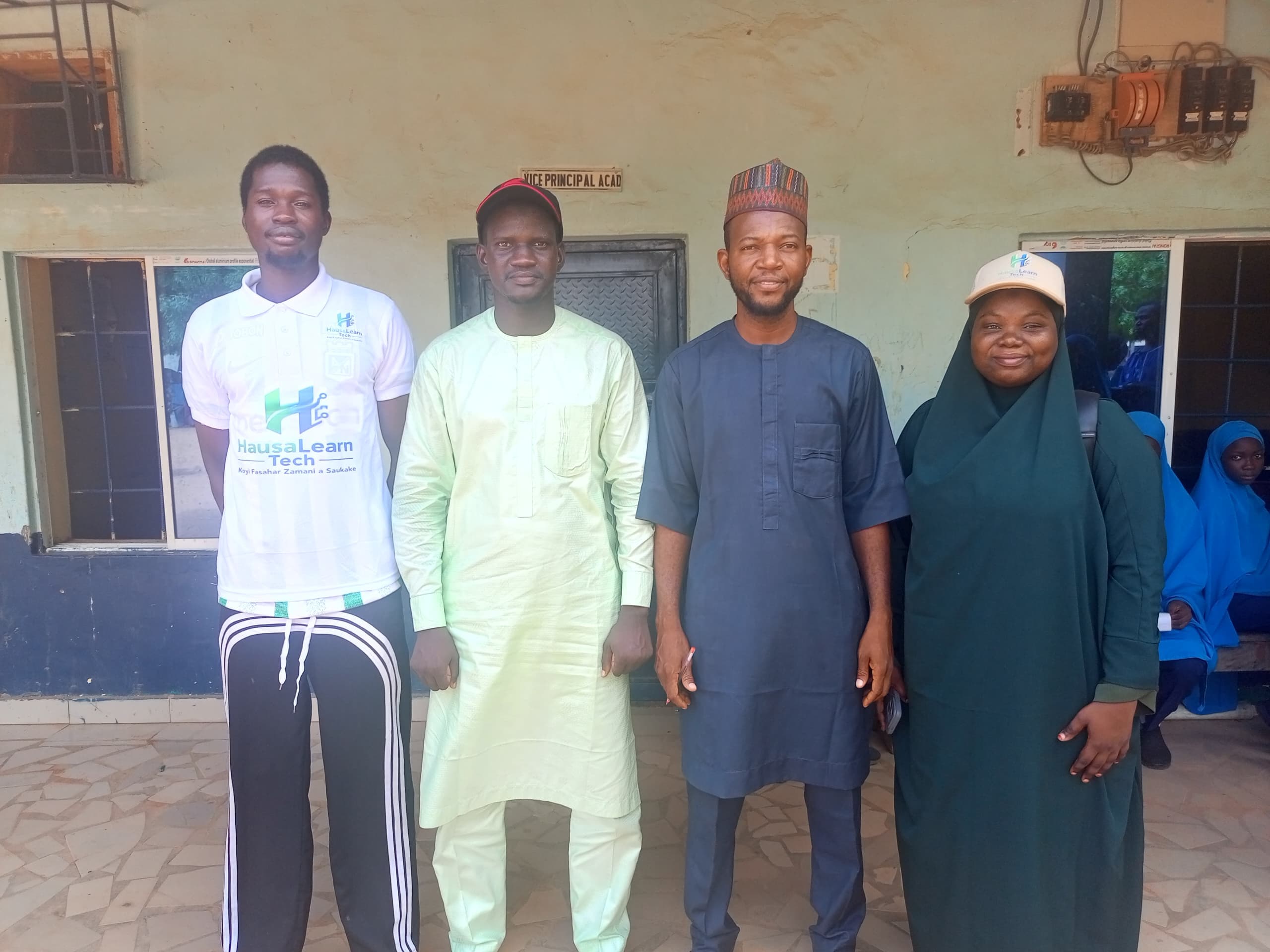 HausaLearn Tech team with school staff outside the Vice Principal's office